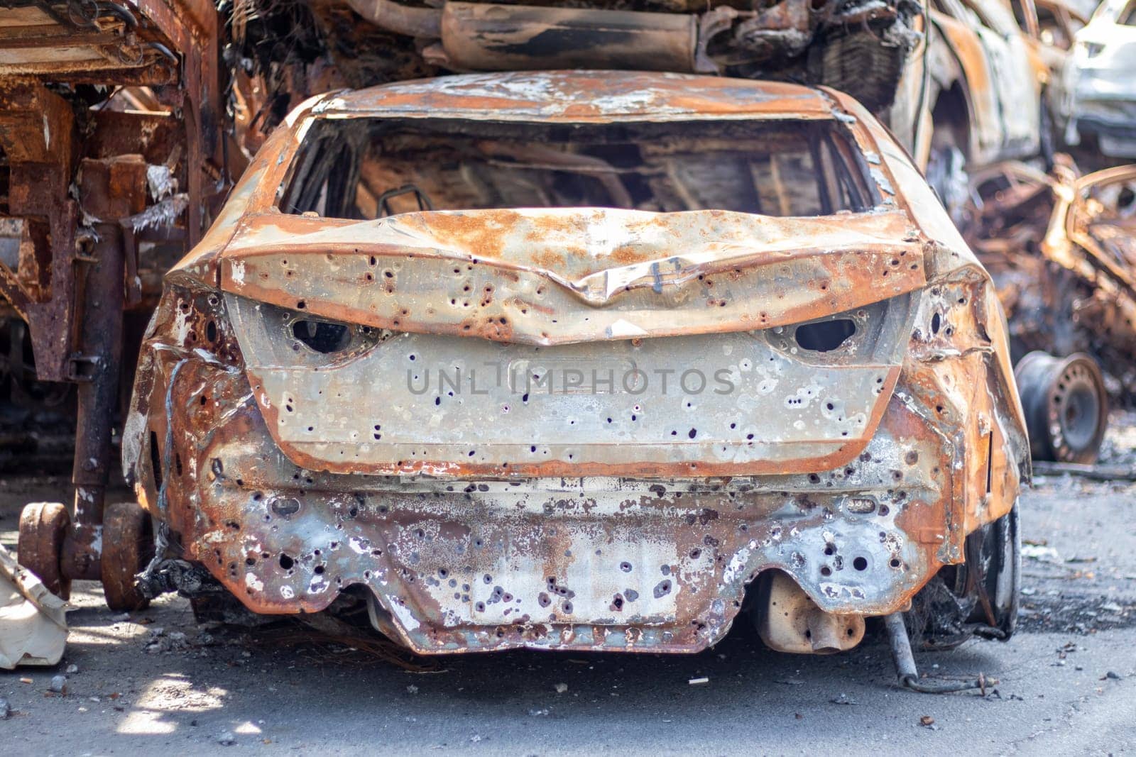 Russian invasion of Ukraine in 2022, destroyed and burned cars. Cars were beaten with shrapnel and burned. Irpensky automobile cemetery. The consequences of the war in a peaceful city near Kyiv