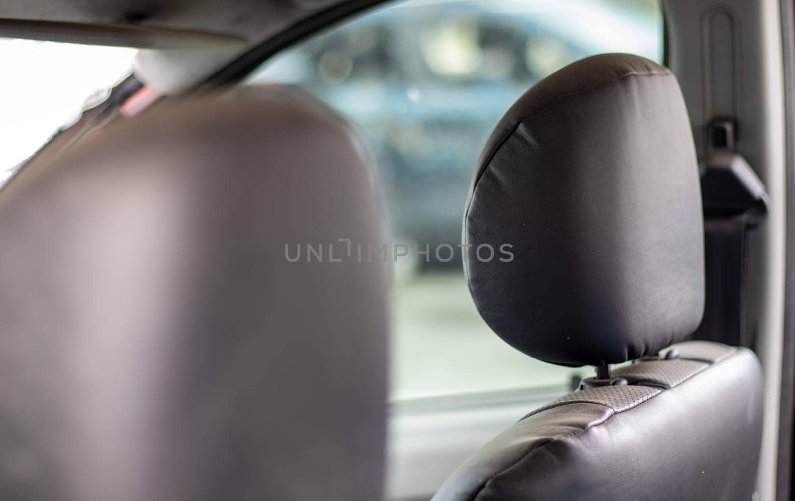 The interior of the car is damaged after the accident, broken glass on the seat. Damaged car interior