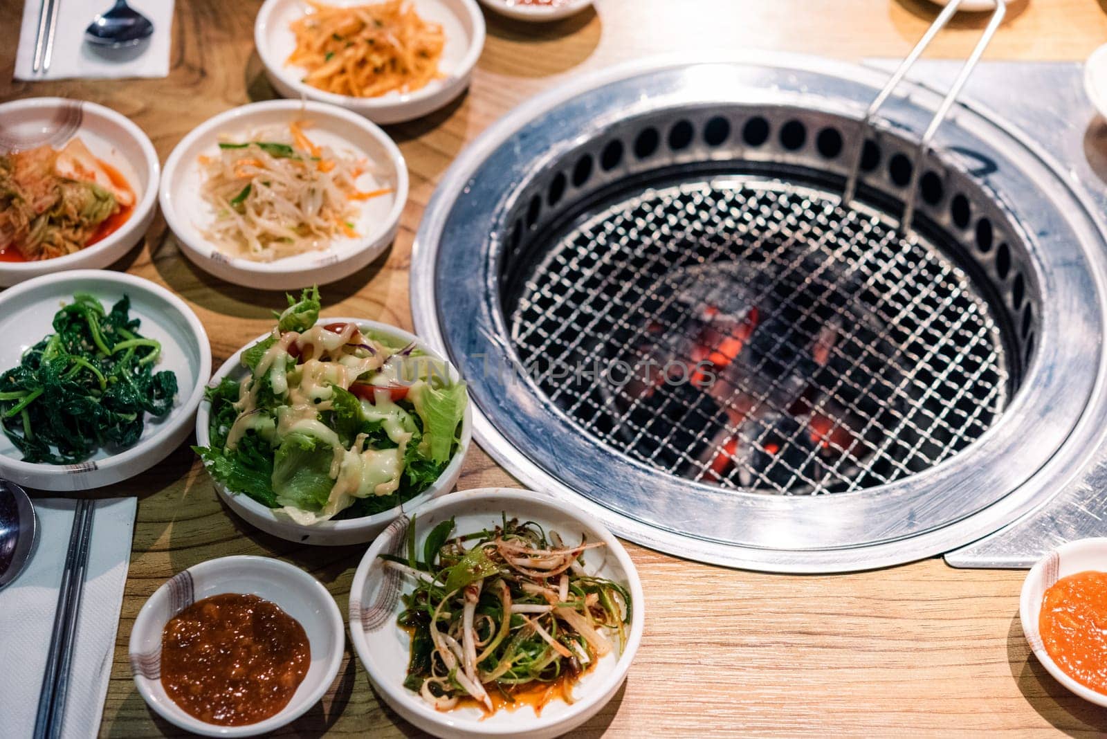 Spicy Kimchi group. Korean pickle or Pickled radish vegetables set and seasoning on bowl on stove serve wood table background, Japanese food