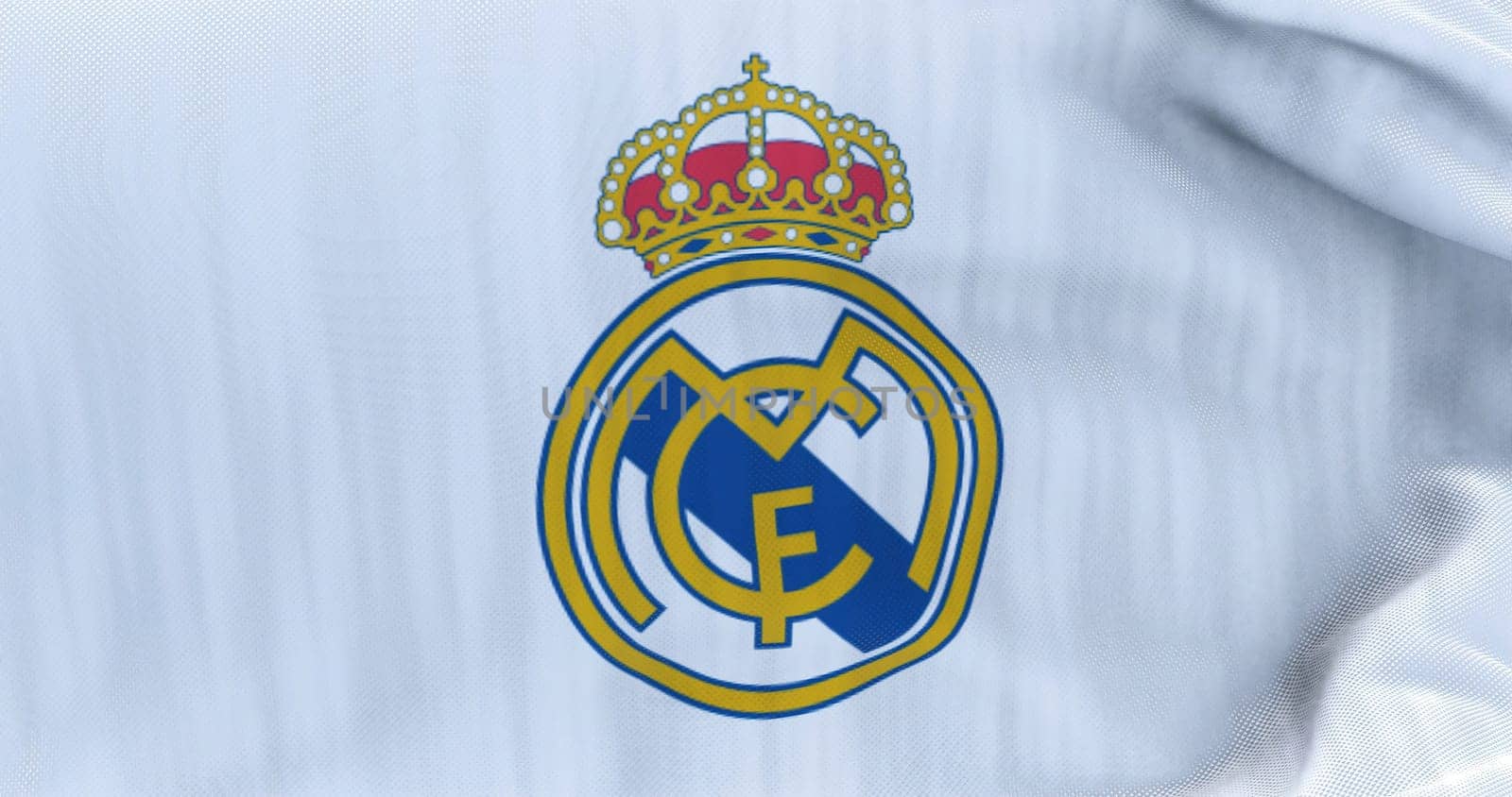 Madrid, Spain, May 2022: The flag of Real Madrid Club de Futbol waving in the wind on a clear day. Real Madrid C.F. is a Spanish professional football club based in Madrid