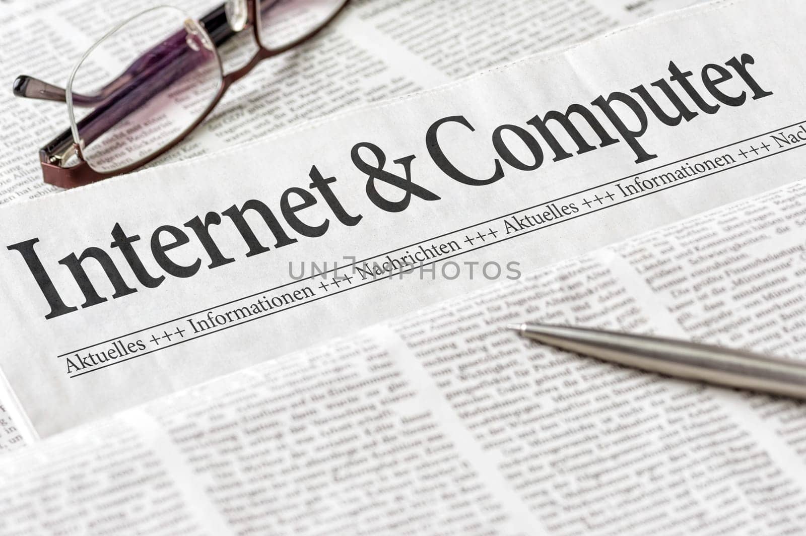 Newspaper headlined Internet and Computer