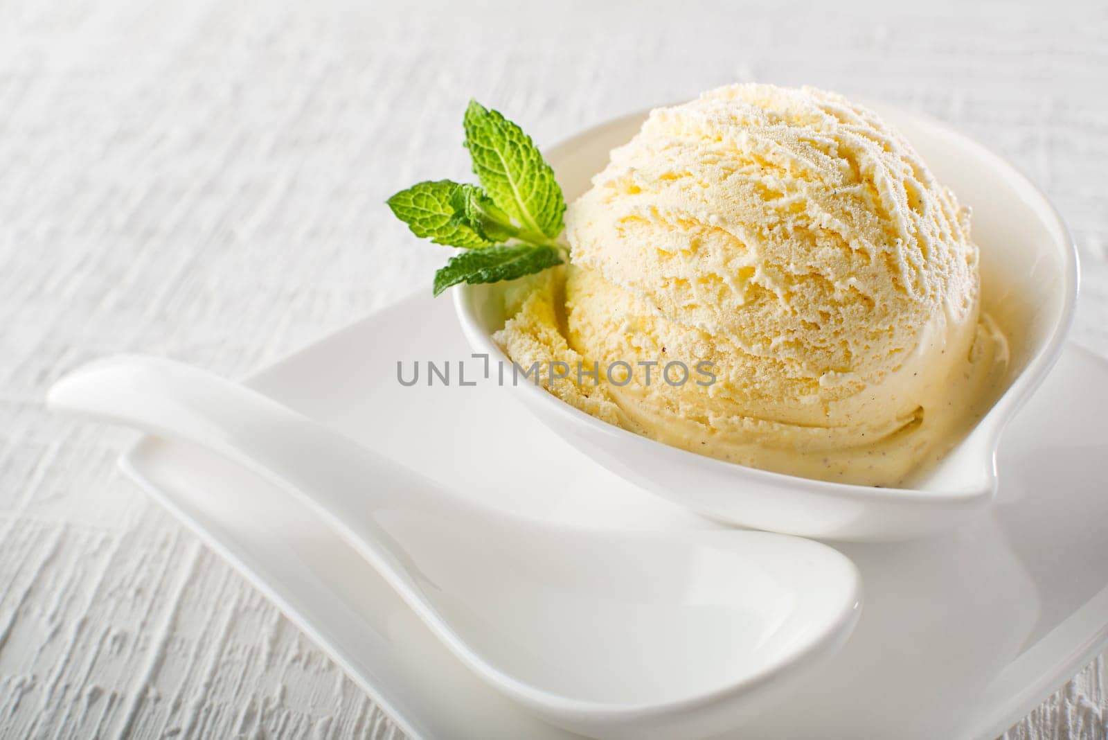 Ice cream in bowl on white background
