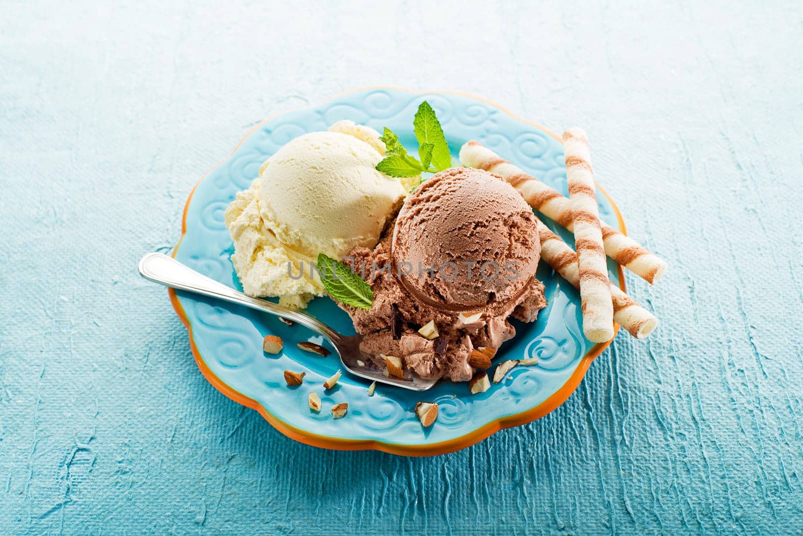 Vanilla and chocolate Ice cream on a blue plate