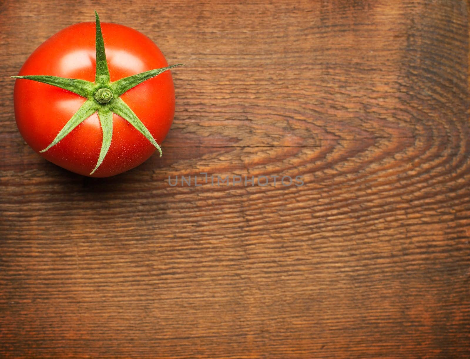 Fresh cherry tomato on rustic wooden background