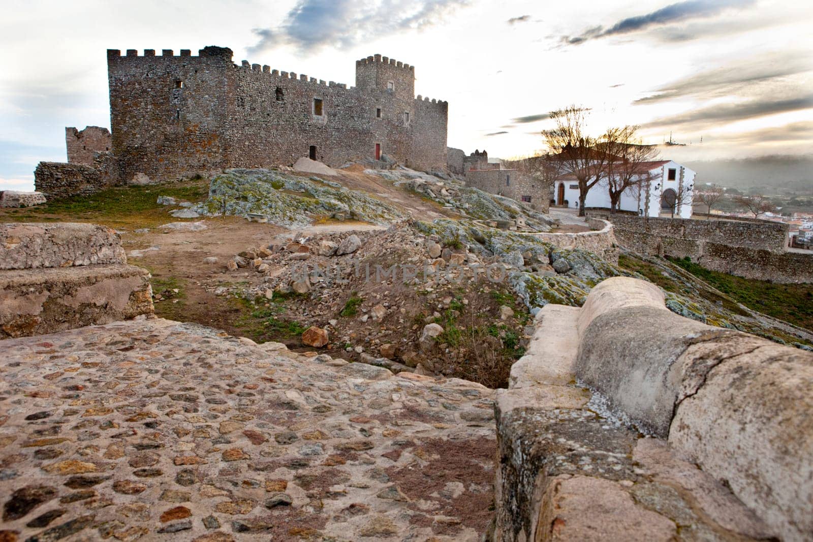 Montanchez town castle remains and hermitage at sunrise, Caceres, Spain