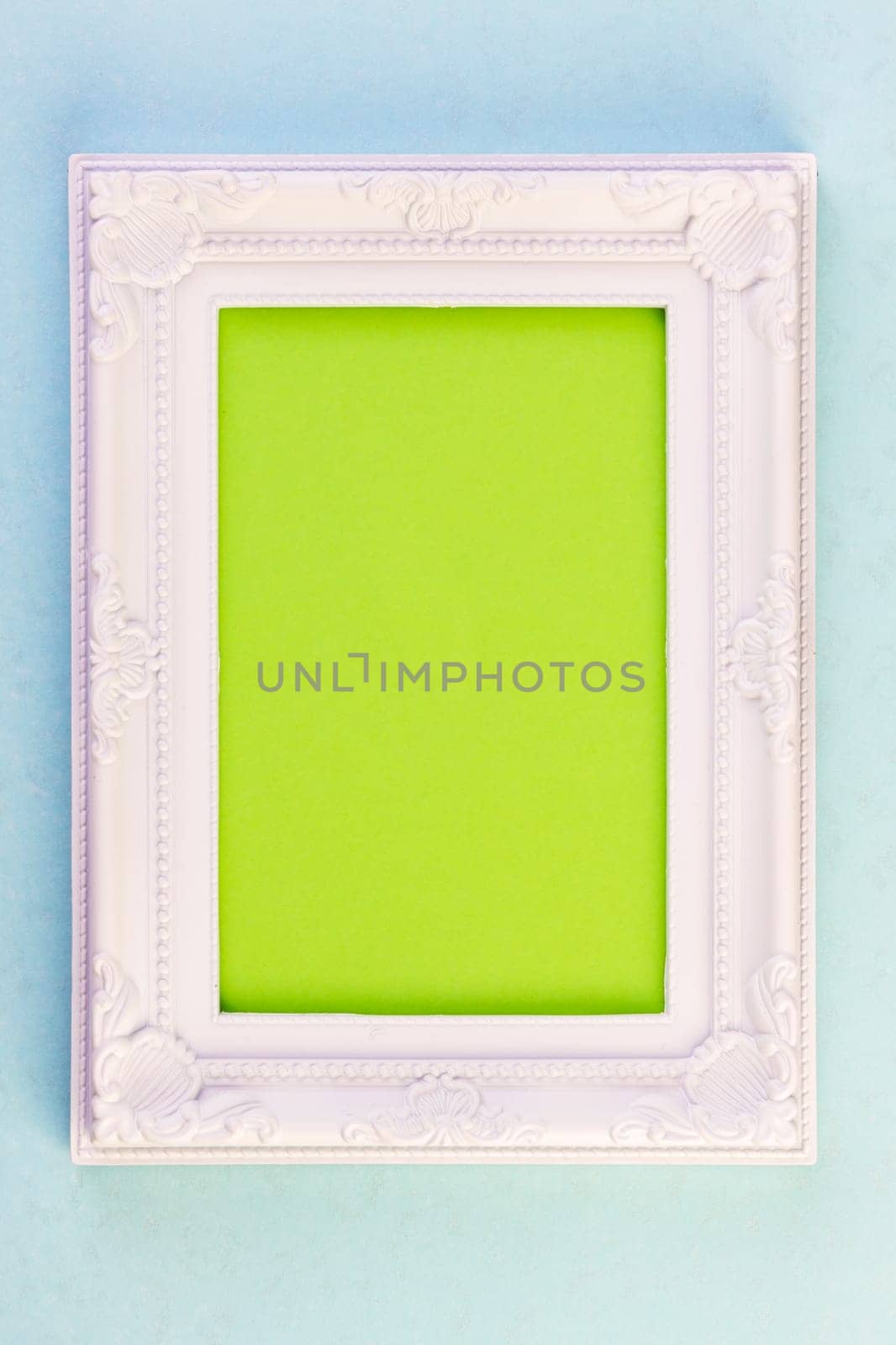 White Frame on blue background with green for your copy