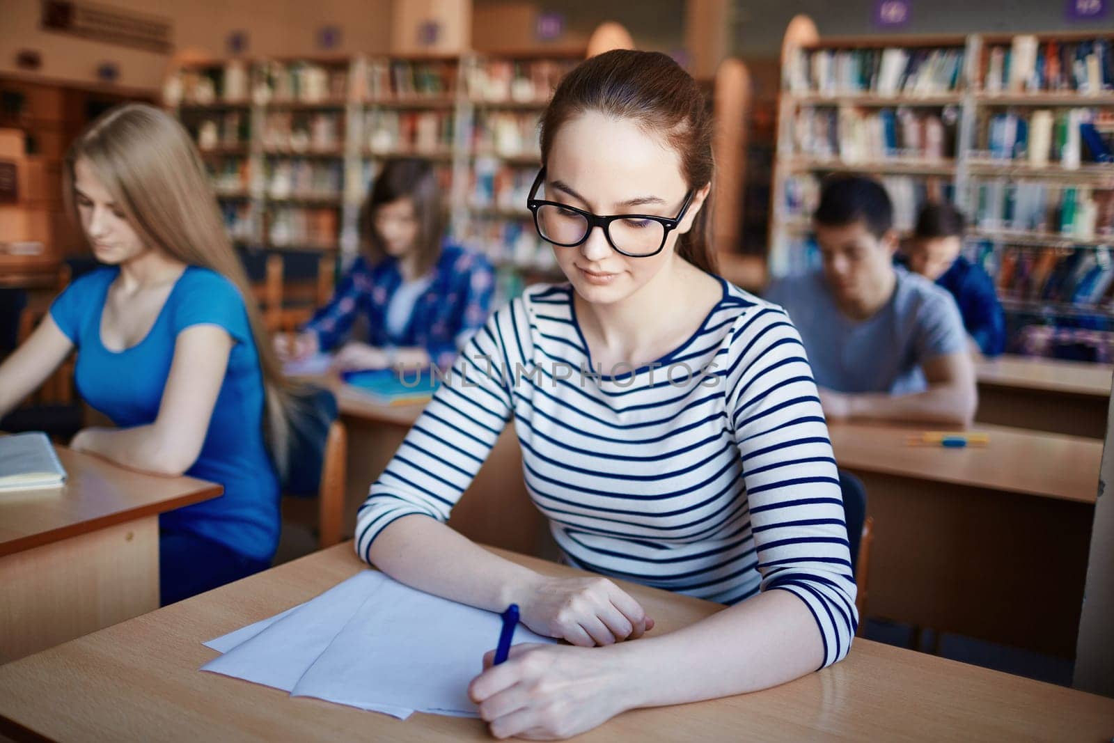 Pretty learner writing test or making notes