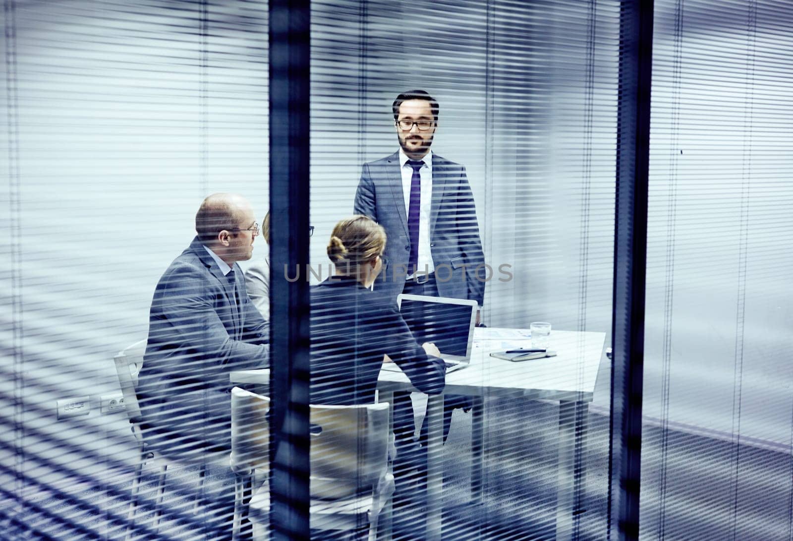 Serious co-workers having consultation in office