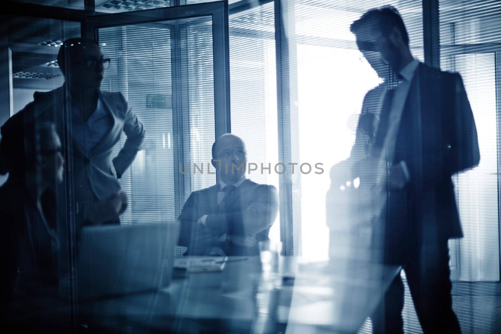 Business team consulting or planning work at meeting