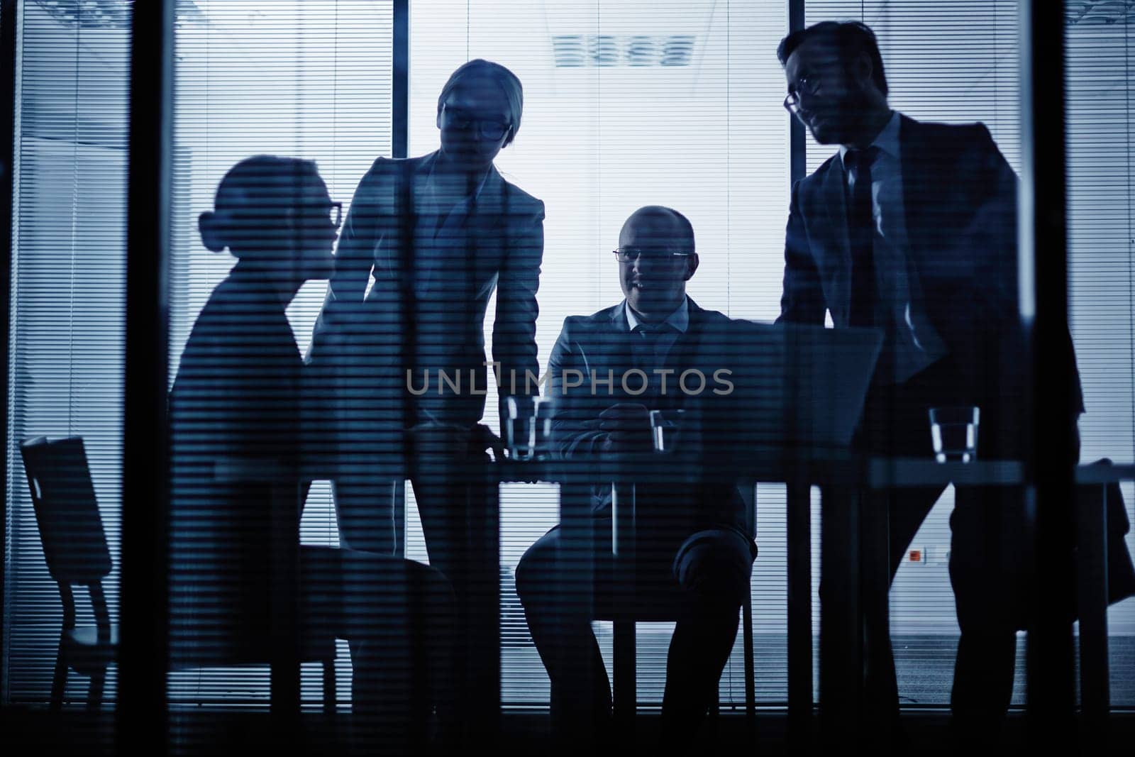 Young co-workers listening to businesswoman ideas in office
