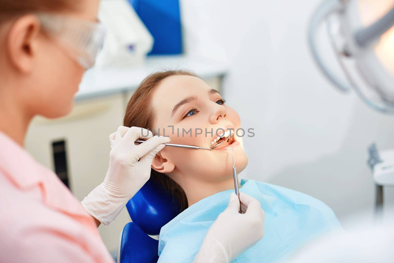 Young female having mouth checkup