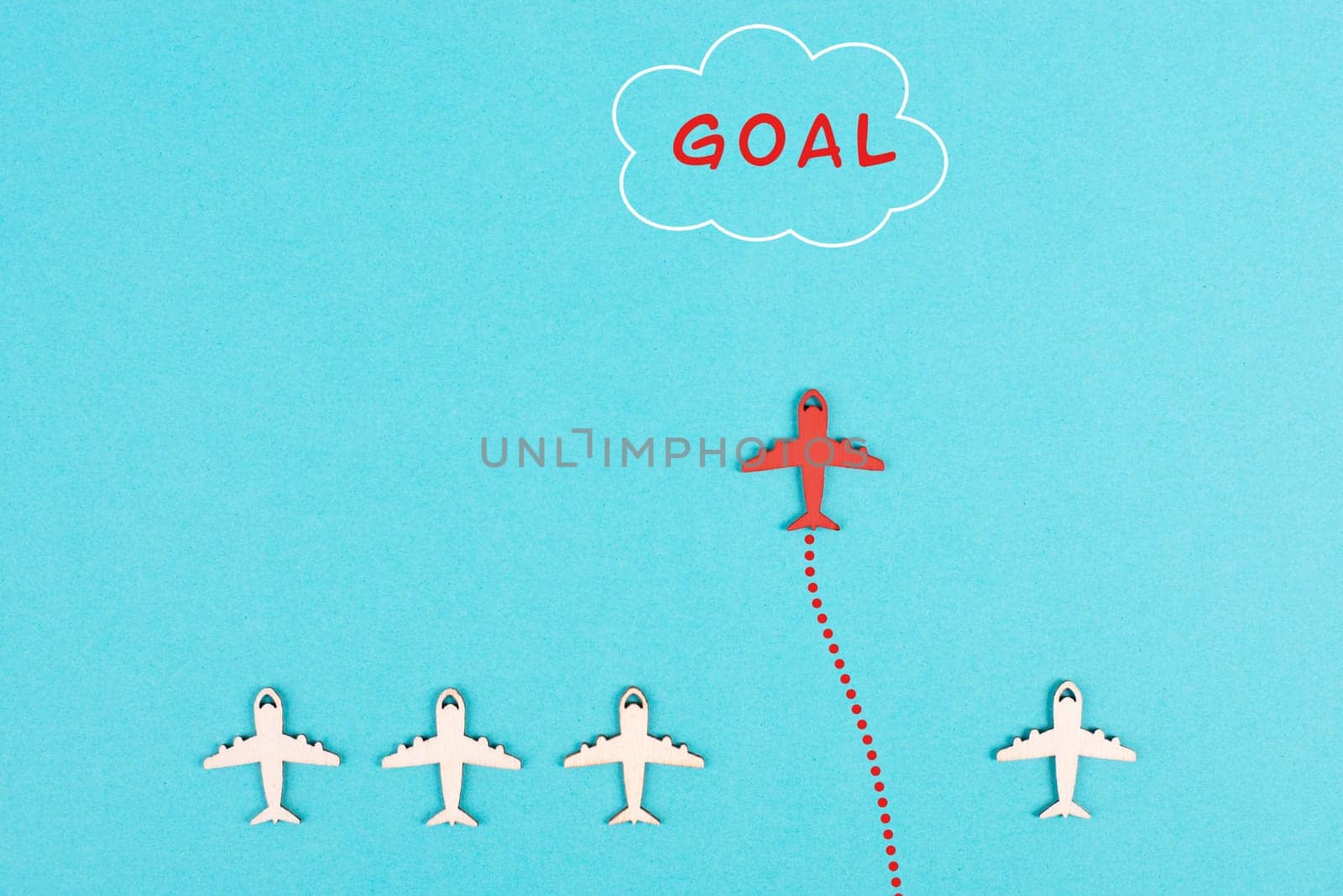 Red airplane is flying to his goal, leadership, courage and winner concept, standing out from the crowd, positive mindset for success in business