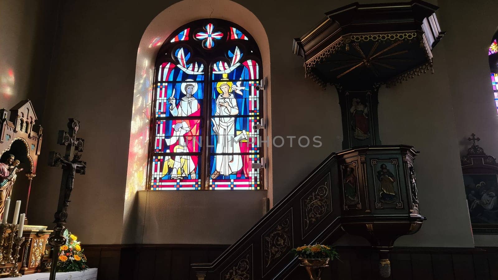 ROSPORT, LUXEMBURG  - APRIL 16, 2022:.Rosport, Luxemburg - April 16, 2022:.In the parish church of Rosport near the Tudor Museum on the border between Luxembourg and Germany
