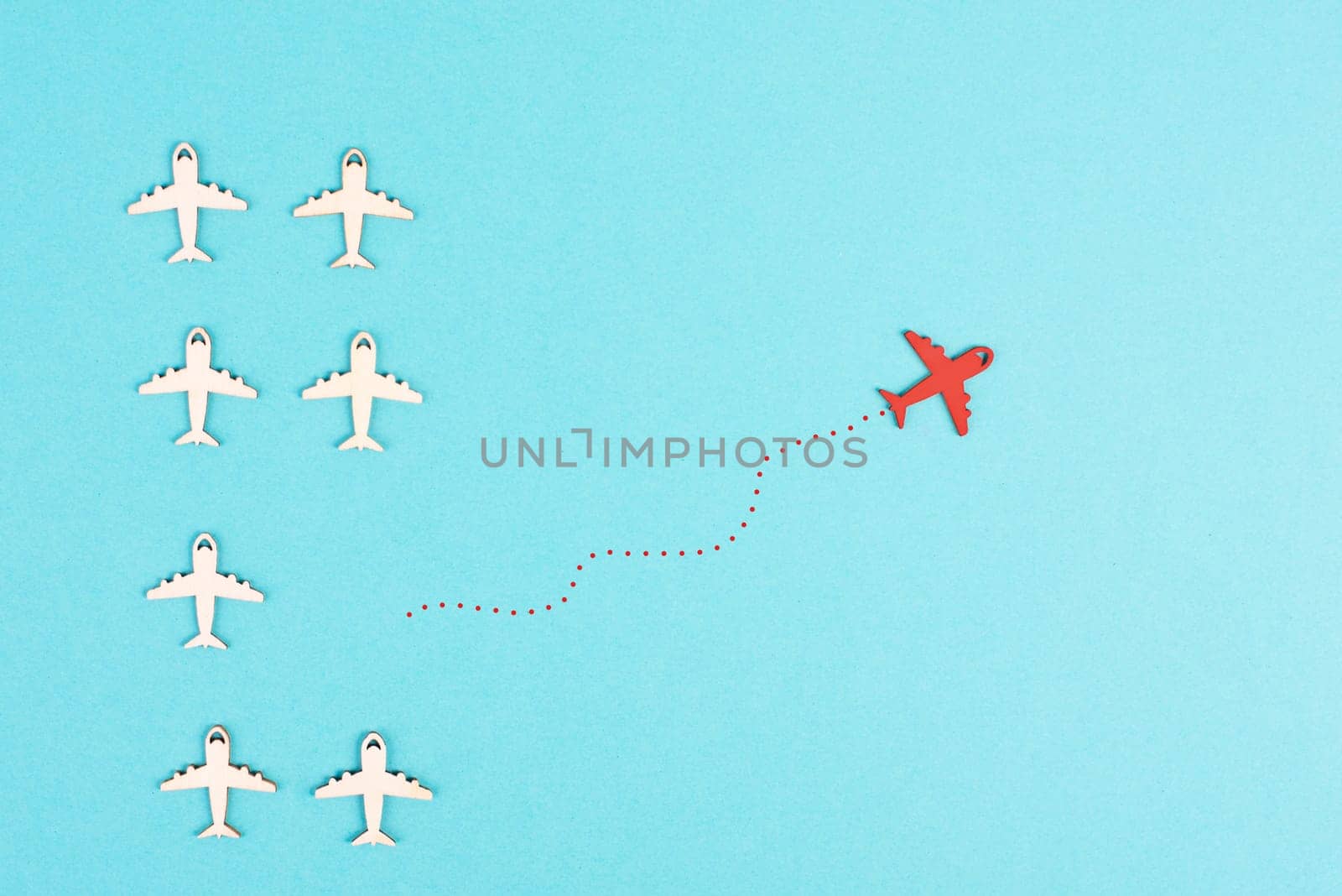 Airplanes following the group, red plane thinks different and takes the opposite direction, leadership, courage and winner concept