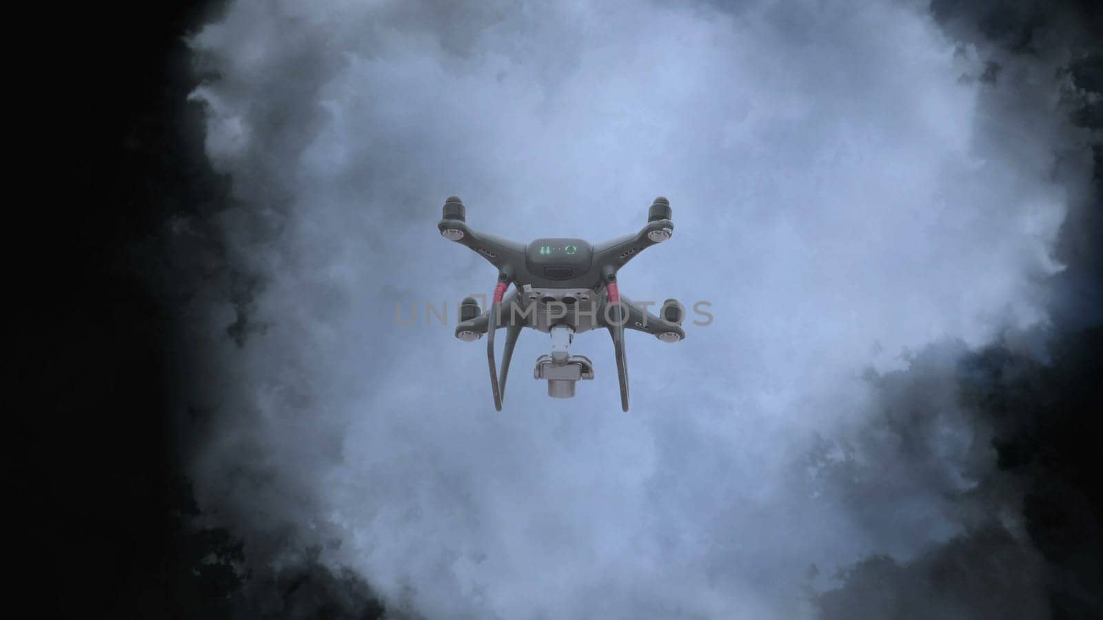 Drone flying aganst stormy clouds