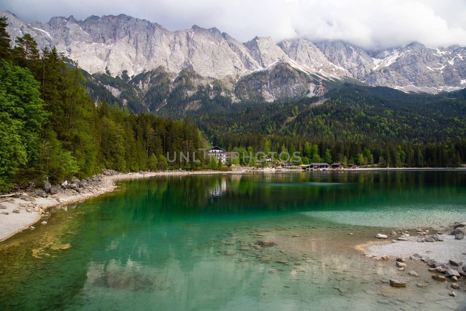 Faboulus landscape of Eibsee Lake with turquoise water in front of Zugspitze summit, Garmisch-Partenkirchen, Bavarian alps, Germany, Europe