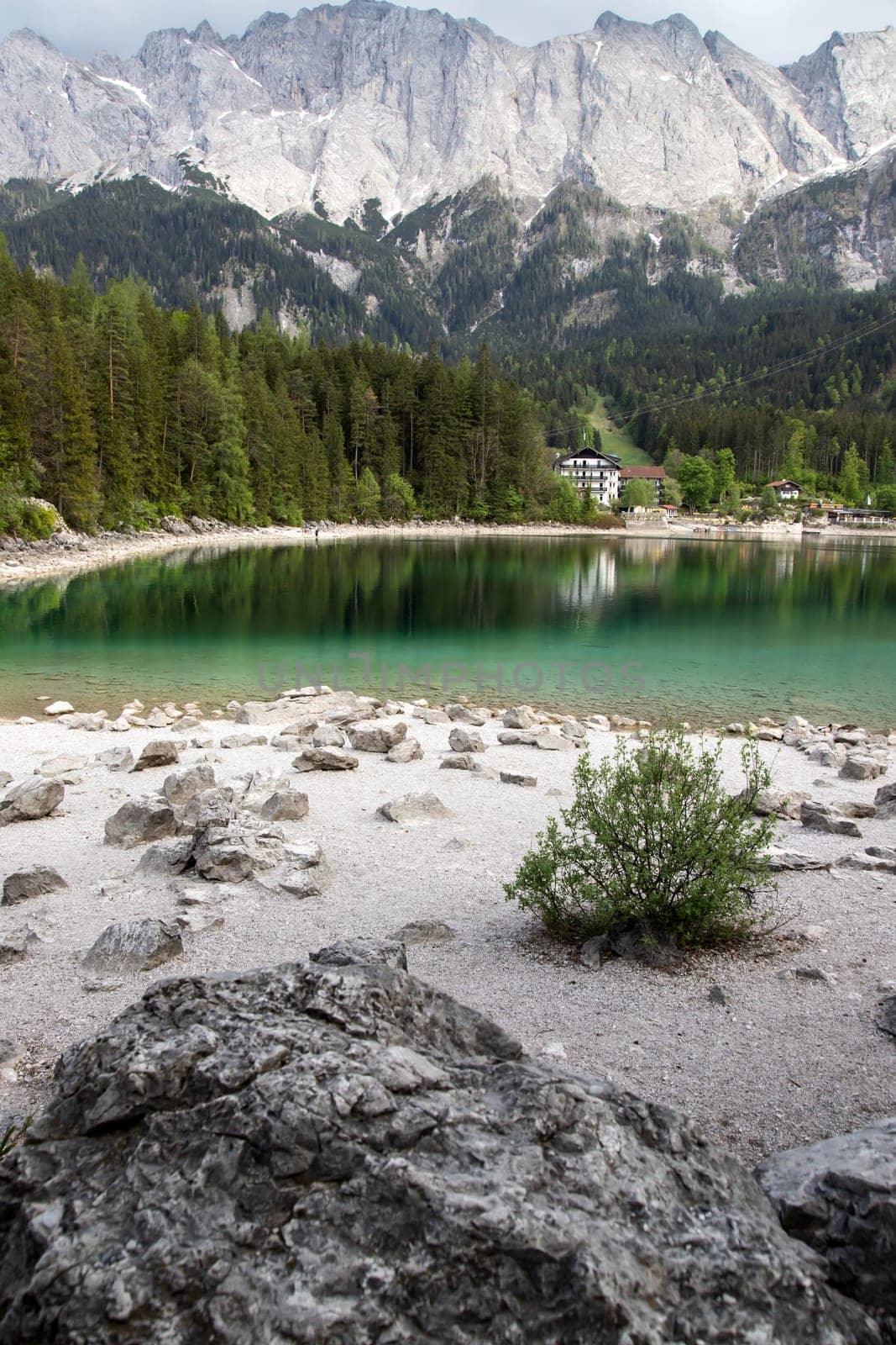 Faboulus landscape of Eibsee Lake with turquoise water in front of Zugspitze summit, Garmisch-Partenkirchen, Bavarian alps, Germany, Europe