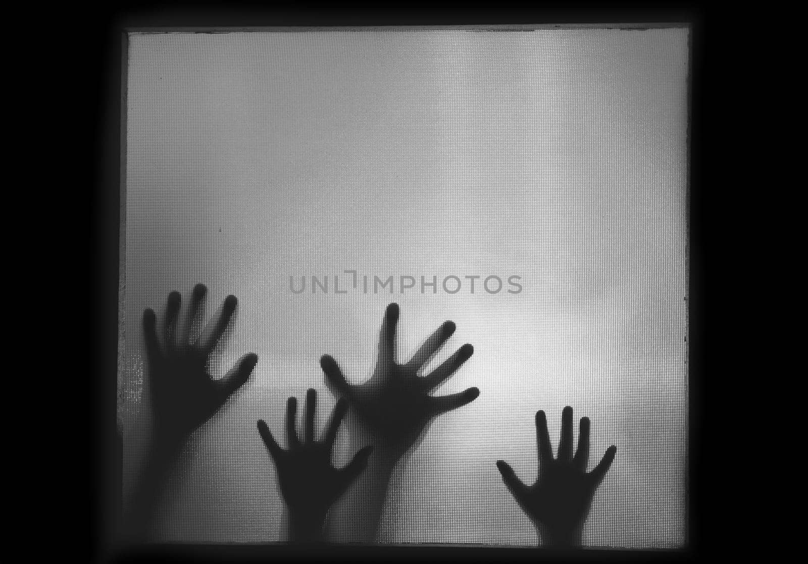 Horror, halloween background - Shadowy figure hands behind glass
