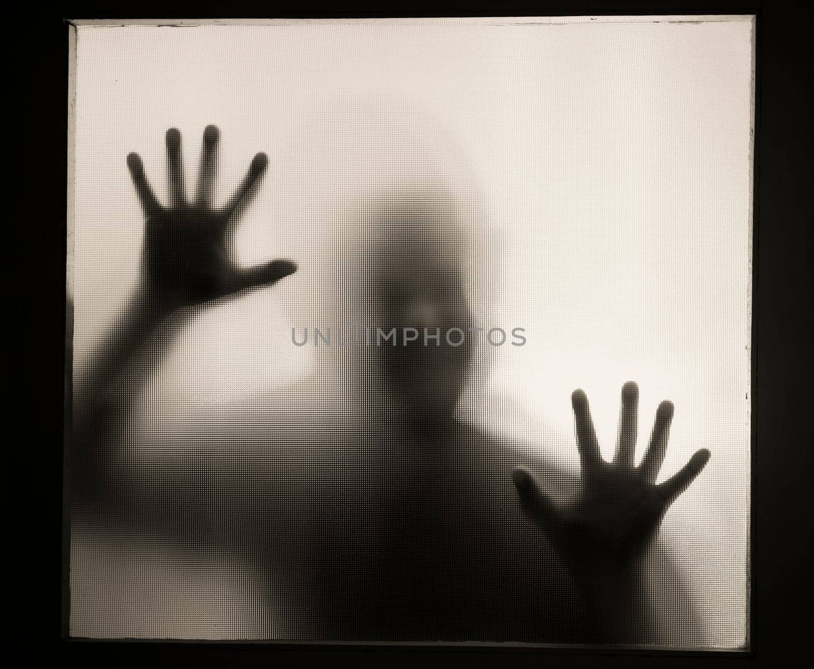 Horror, halloween background - Shadowy figure behind glass of a man