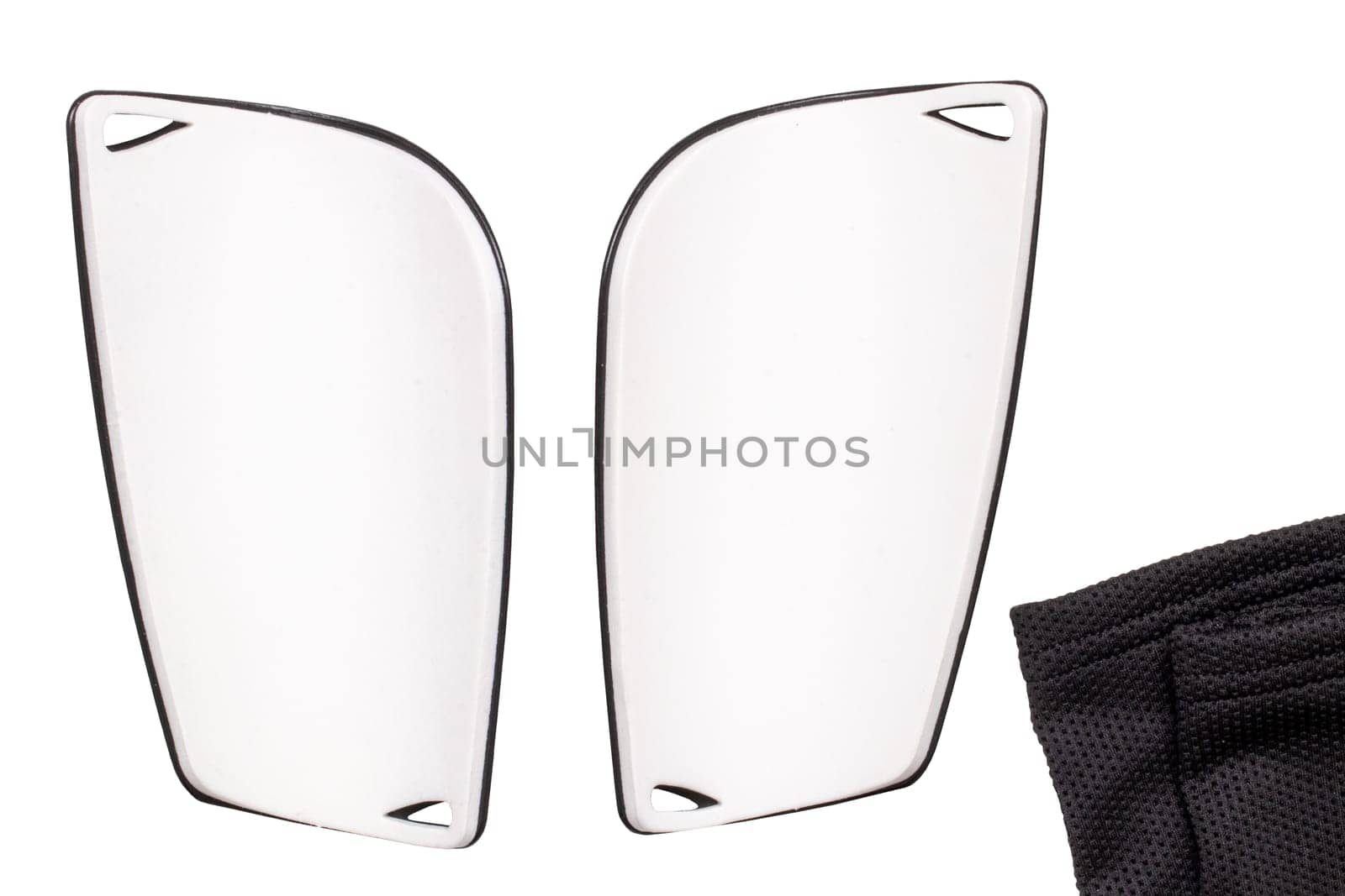 Football protection of the feet. Close-up of a pair of silver-grey striped padded shin guards isolated on a white background. Shinguards protect against fractures and bruises. Back view.