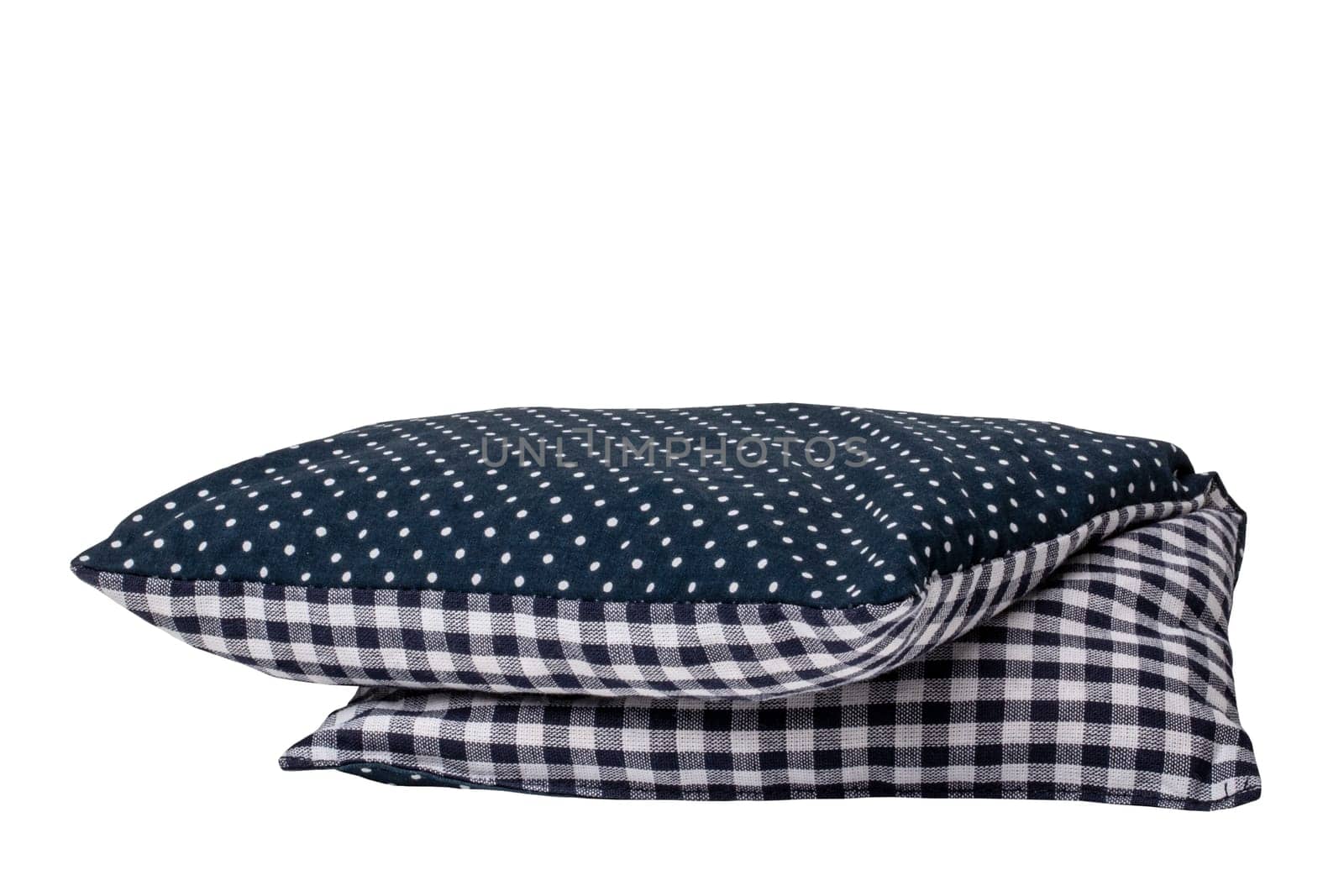 Closeup of a folded cherry pit filled pillow for pain and tension isolated on white background. Clipping path. Copy space for your product presentation montage. Macro.
