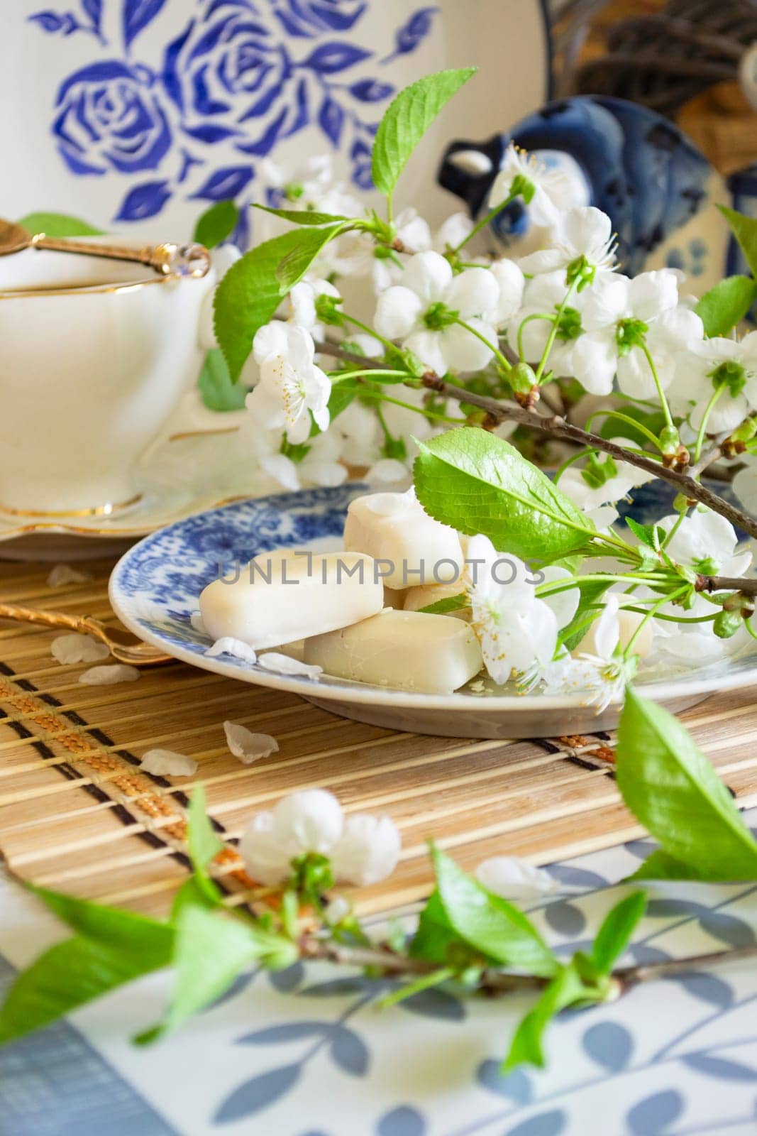 Homemade white chocolate bonbon candies. Tenderness morning coffee concept. Vertical image