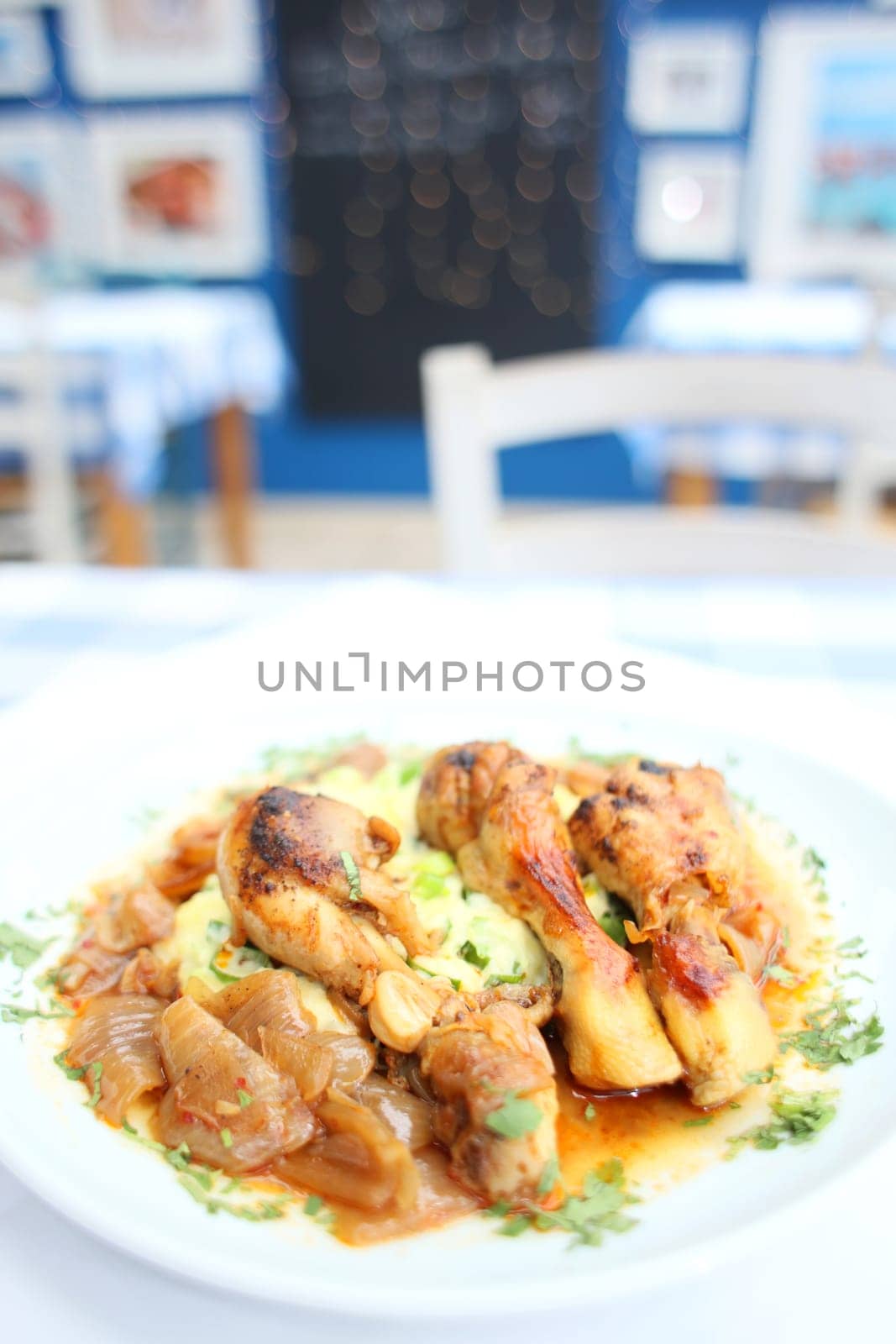 Chicken legs close up braised with butcher's onions served with mashed herb potatoes greek cuisine modern high quality print