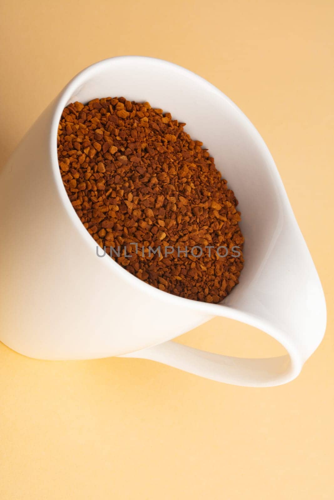 Powdered Coffee in a beautiful Coffee Cup on beige background