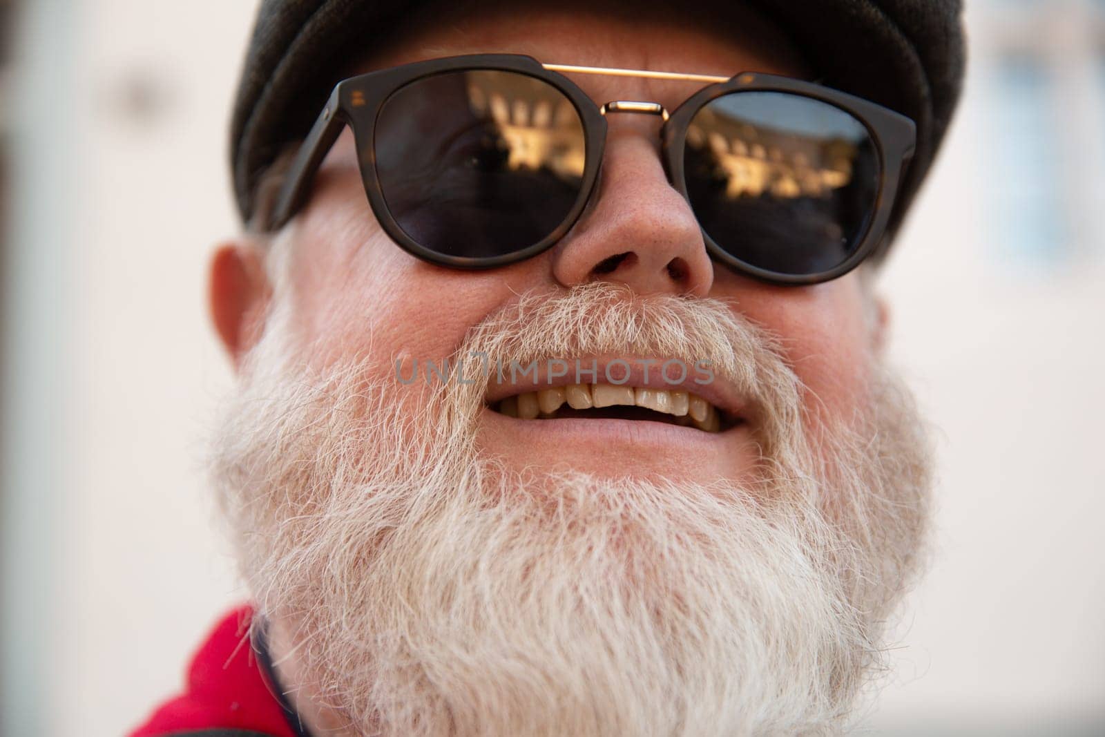 Headshot from friendly male man with big white beard