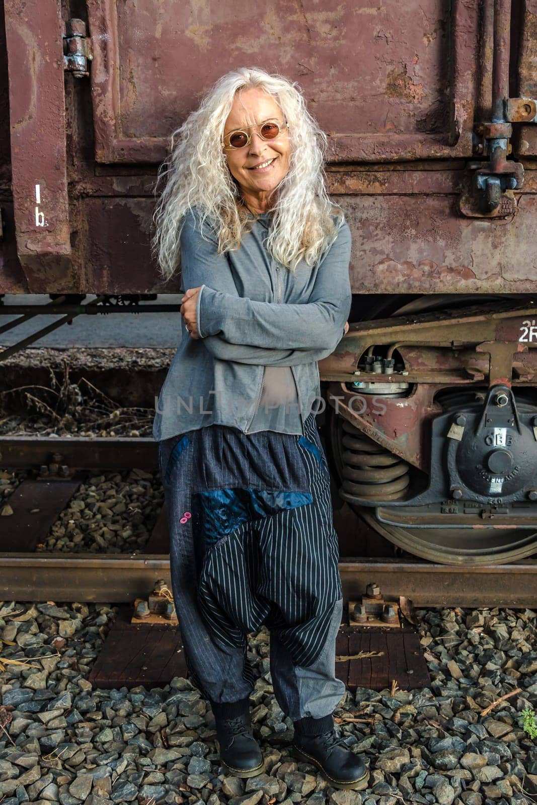 Beautiful Lady in the 50s with industry freight train in the background