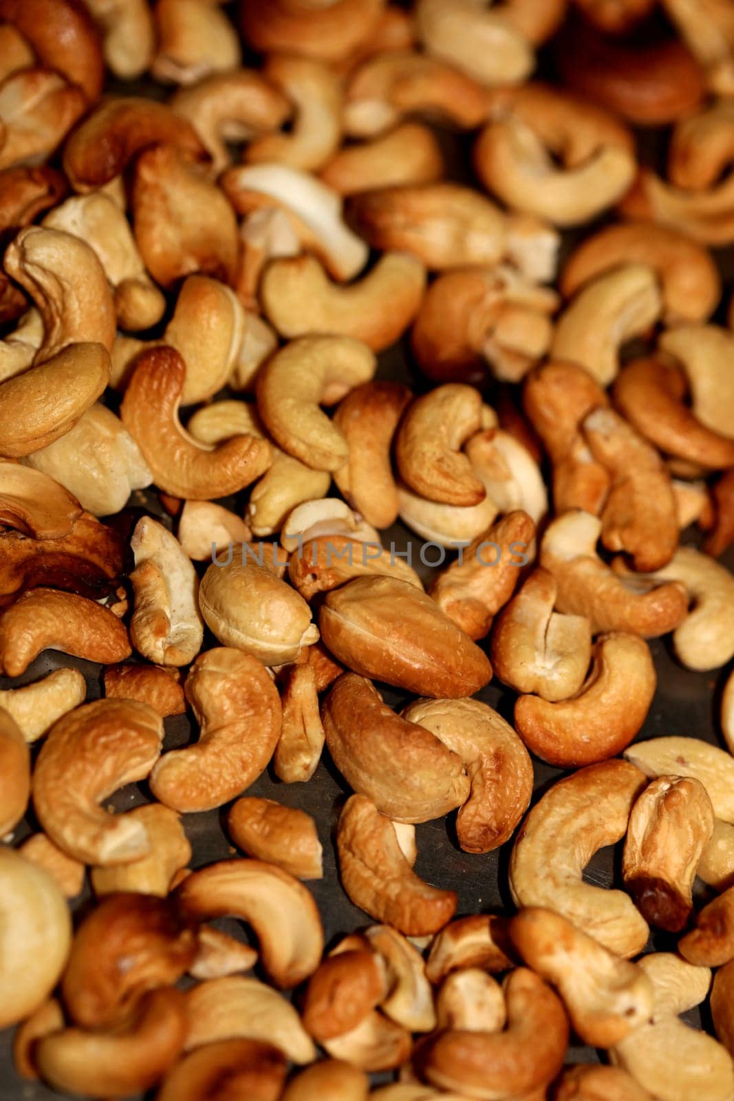 Backed cashews close up background modern high quality print Anacardium occidentale family anacardiaceae