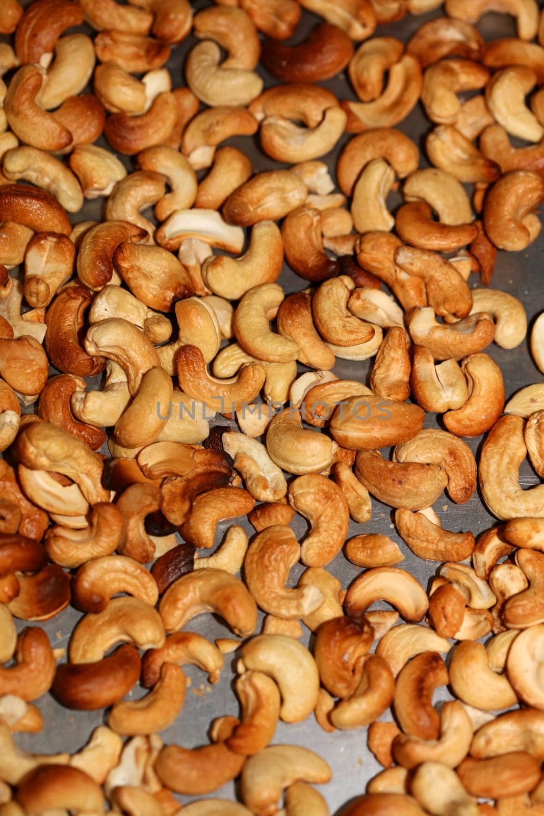 Backed cashews close up background modern high quality print Anacardium occidentale family anacardiaceae