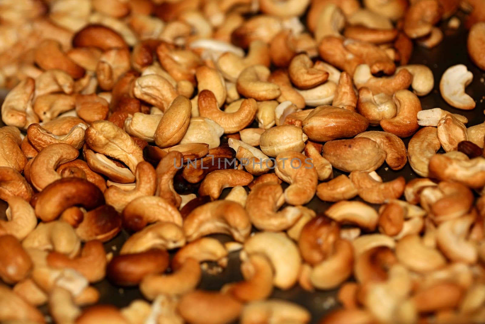Backed cashews close up background modern high quality print Anacardium occidentale family anacardiaceae