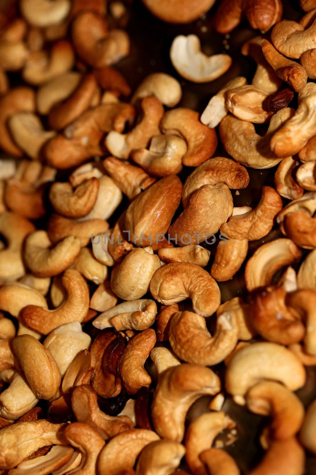 Backed cashews close up background modern high quality print Anacardium occidentale family anacardiaceae
