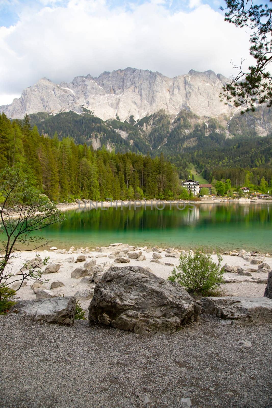 Faboulus landscape of Eibsee Lake with turquoise water in front of Zugspitze summit, Garmisch-Partenkirchen, Bavarian alps, Germany, Europe