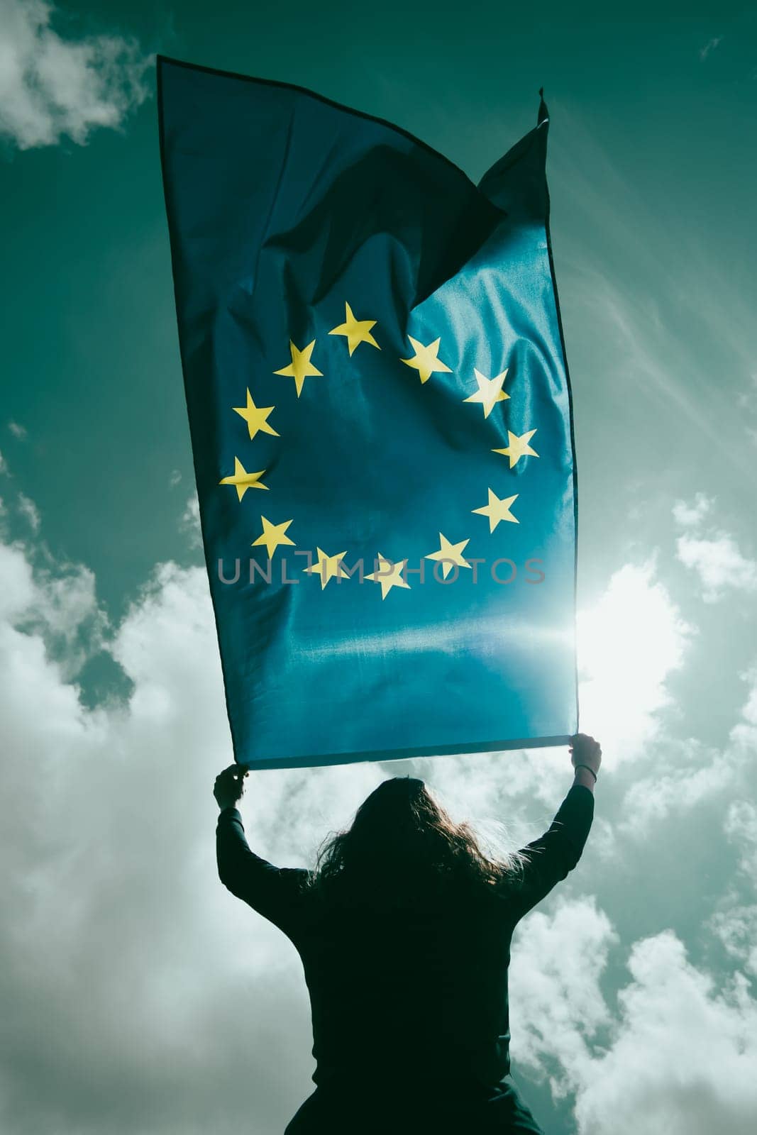 Young woman holding European Union flag. Voting, election concept.