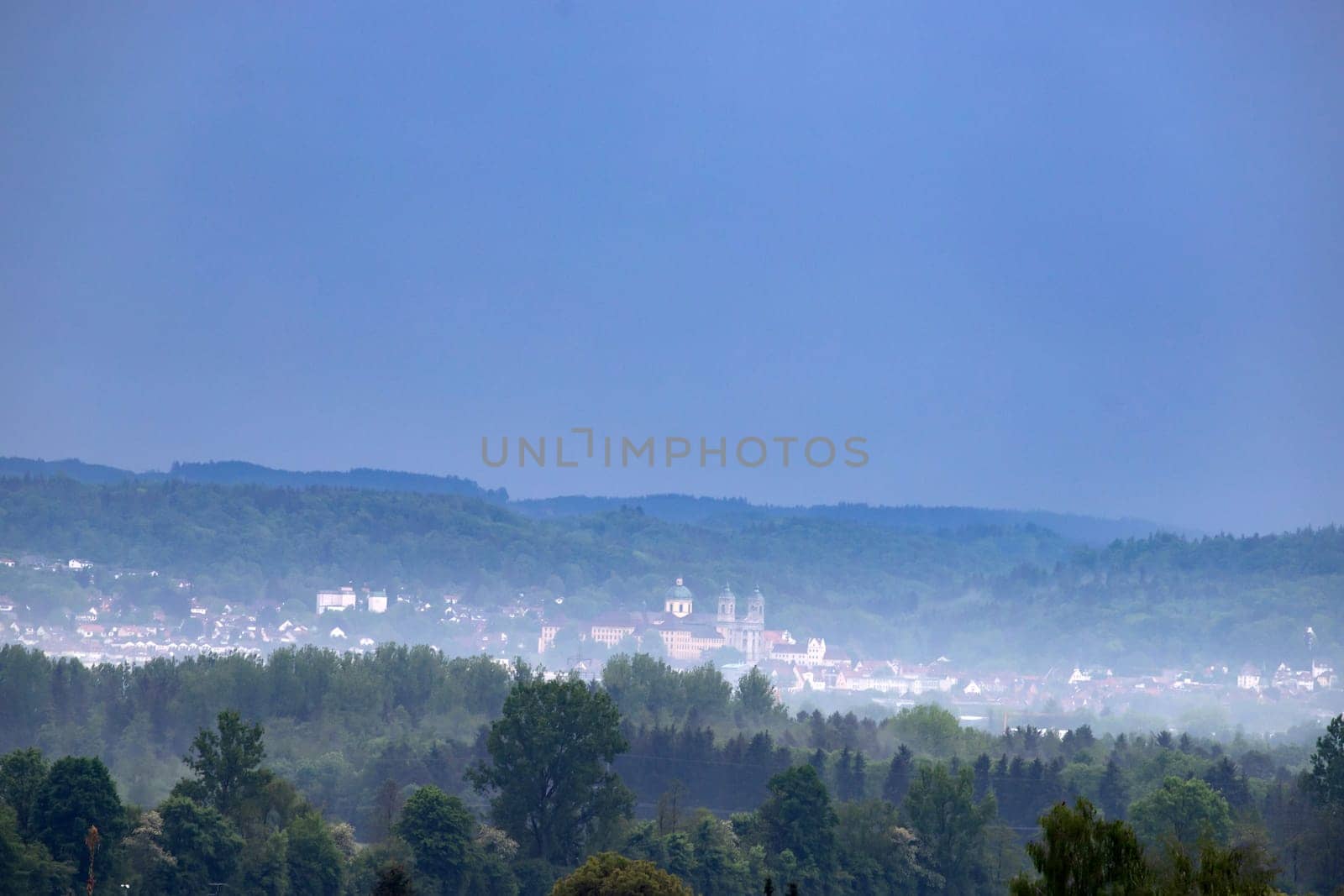 Weingarten, Germany: View at the Basilika over the city on a foggy day