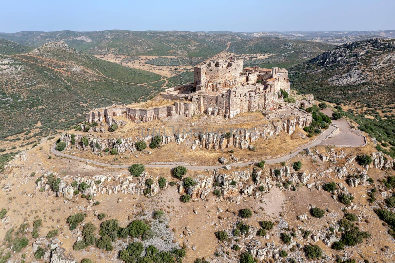 The hilltop castle fortress and former convent of Calatrava La Nueva, in Aldea Real, Ciudad Real province Castilla La Mancha Spain, Aerial view from above
