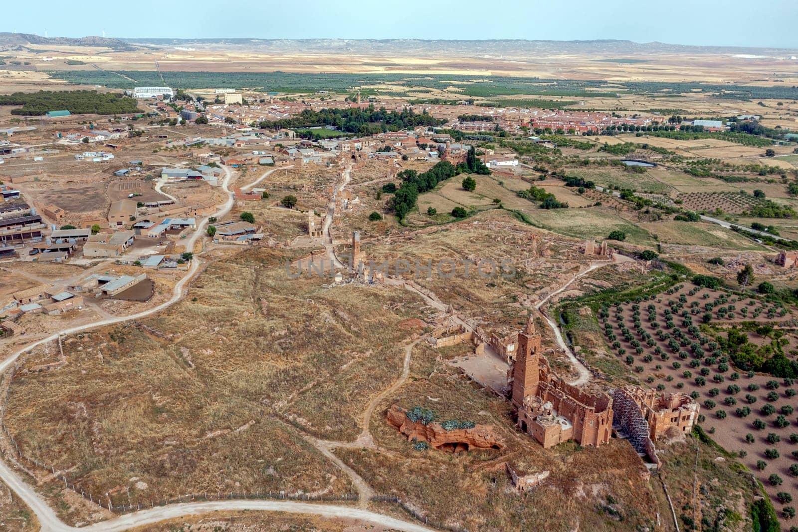 a view of the remains of the old town of Belchite, Zaragoza Spain, destroyed during the Spanish Civil War and abandoned from then, highlighting the San Martin de Tours church, panoramic overview