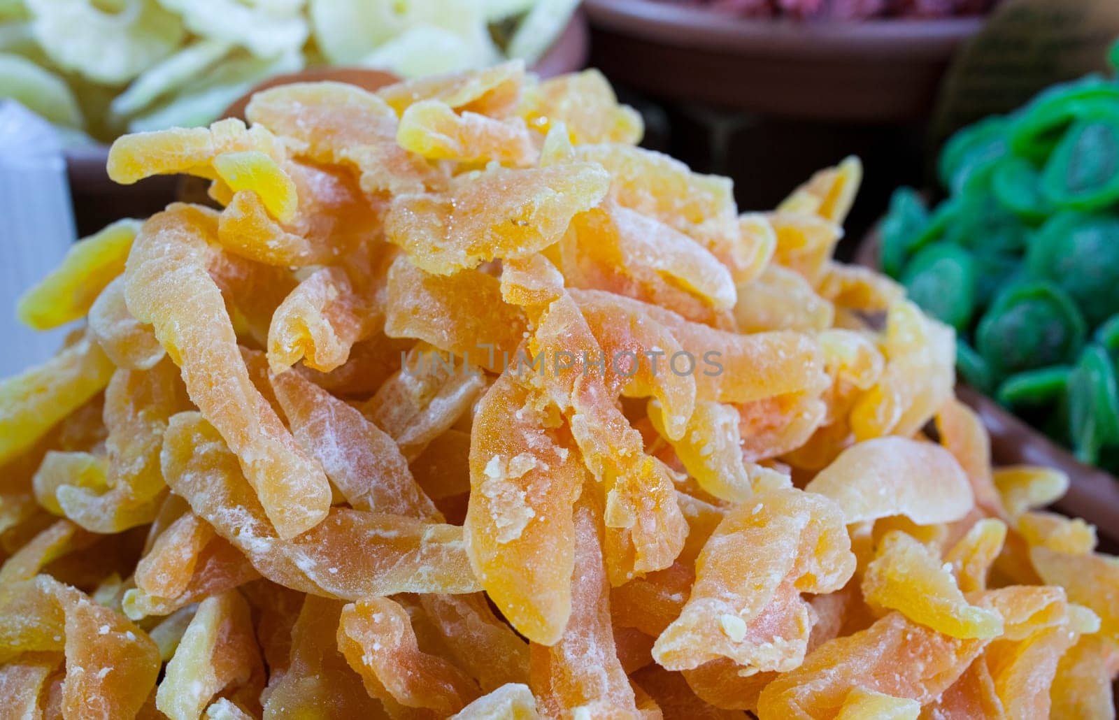 Bowl with dried melon fruit. Slices displayed at street market stall