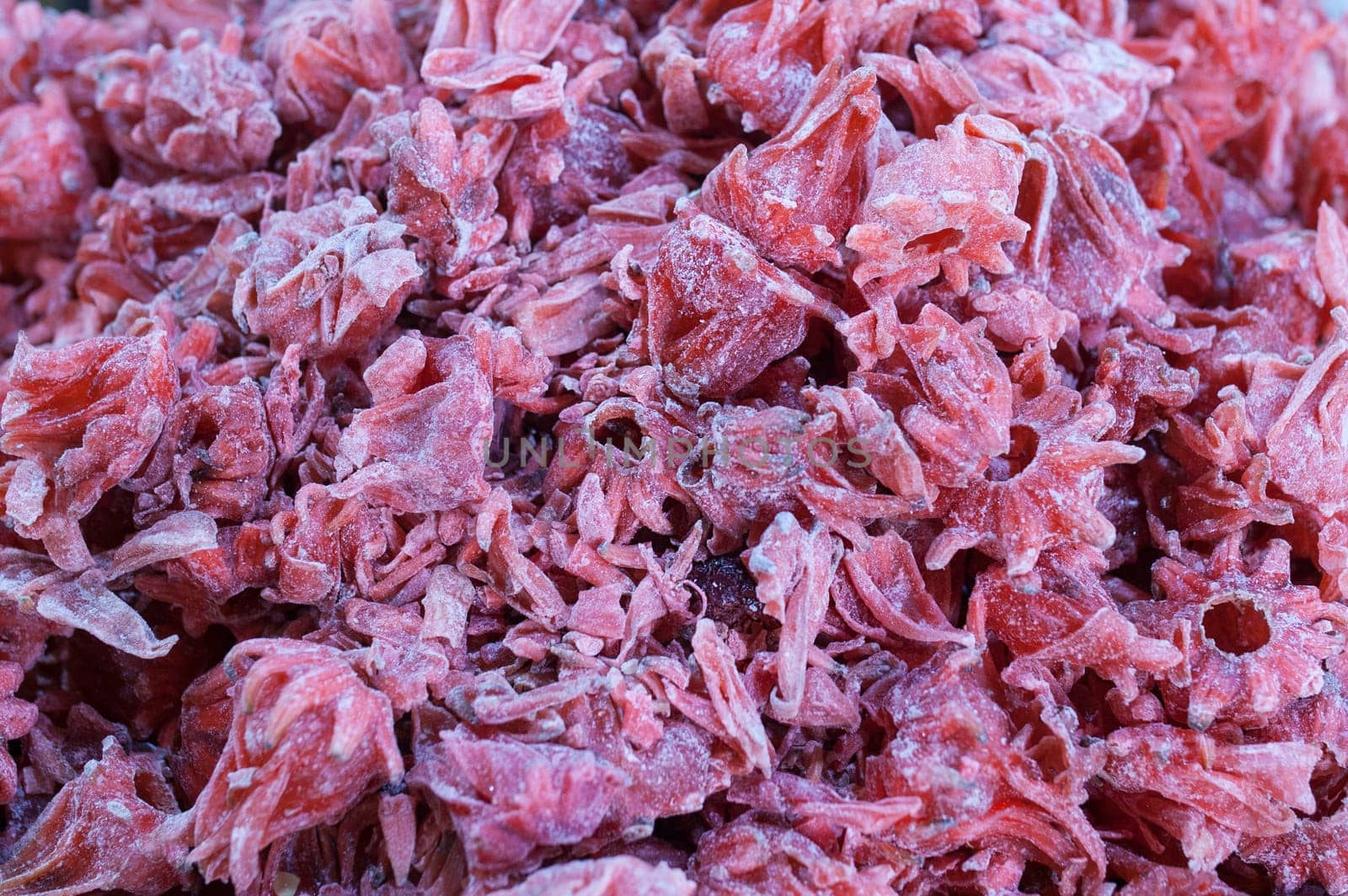 Dried hibiscus flowers. Slices displayed at street market stall