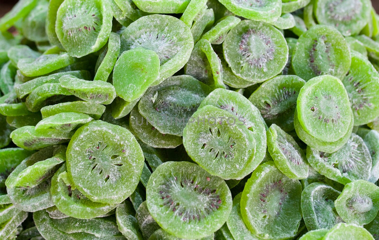 Bowl with dried kiwifruit. Slices displayed at street market stall