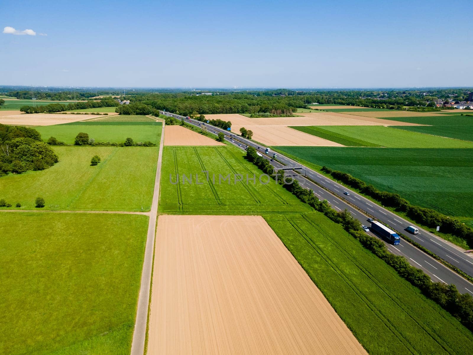 Farmland from above. Aerial view over green fields