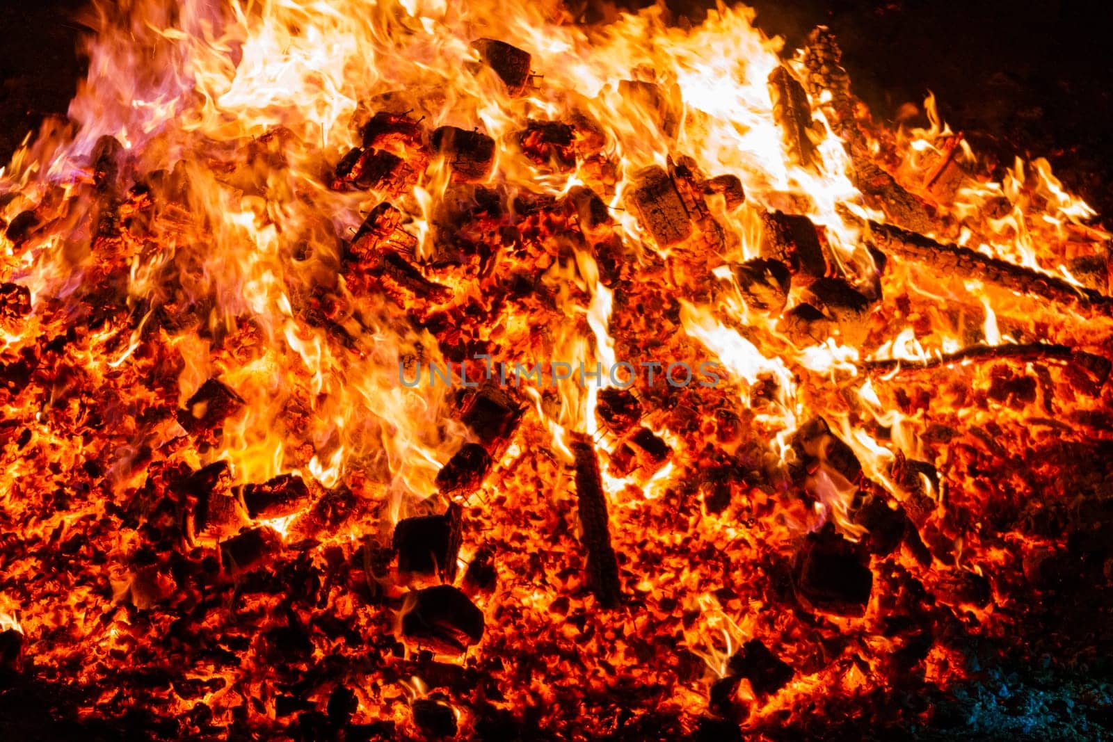 Burning coals from a fire abstract background.