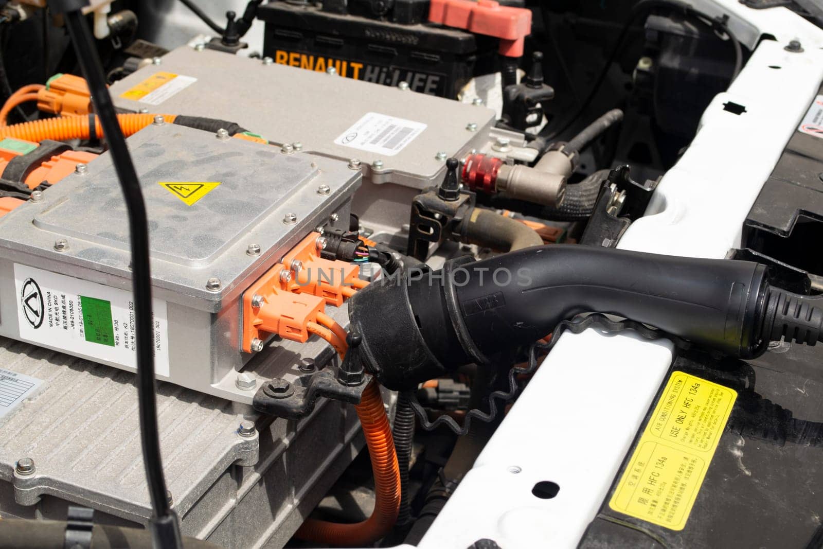 MINSK, BELARUS - 18 JUIN 2022 - an electrocar with a charging cord, connecting it to a charger, electric vehicle service for renault close up