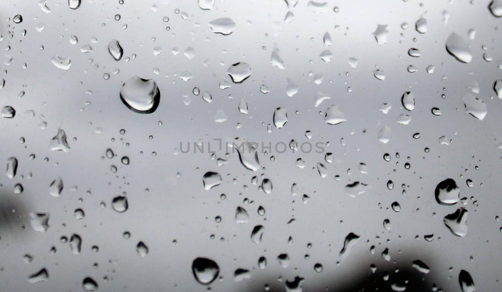 Water droplets on the glass close-up. Background.
