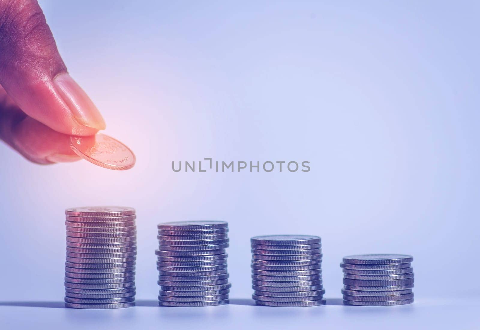 Save money and account banking for finance concept, Hand with coin on blurred background, Save Monney for Investors Using Internet to Trade Stocks or Trade Fund