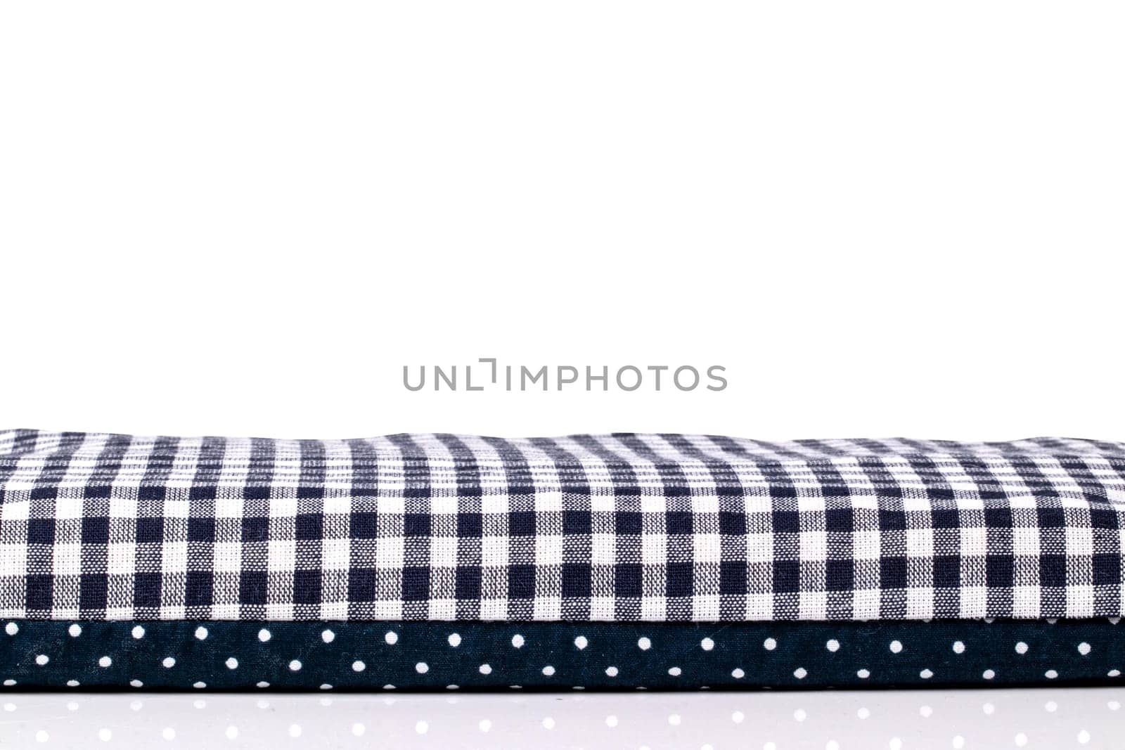 Closeup of a cherry pit filled pillow for pain and tension on a table isolated on white background. Copy space for your product presentation montage. Macro.