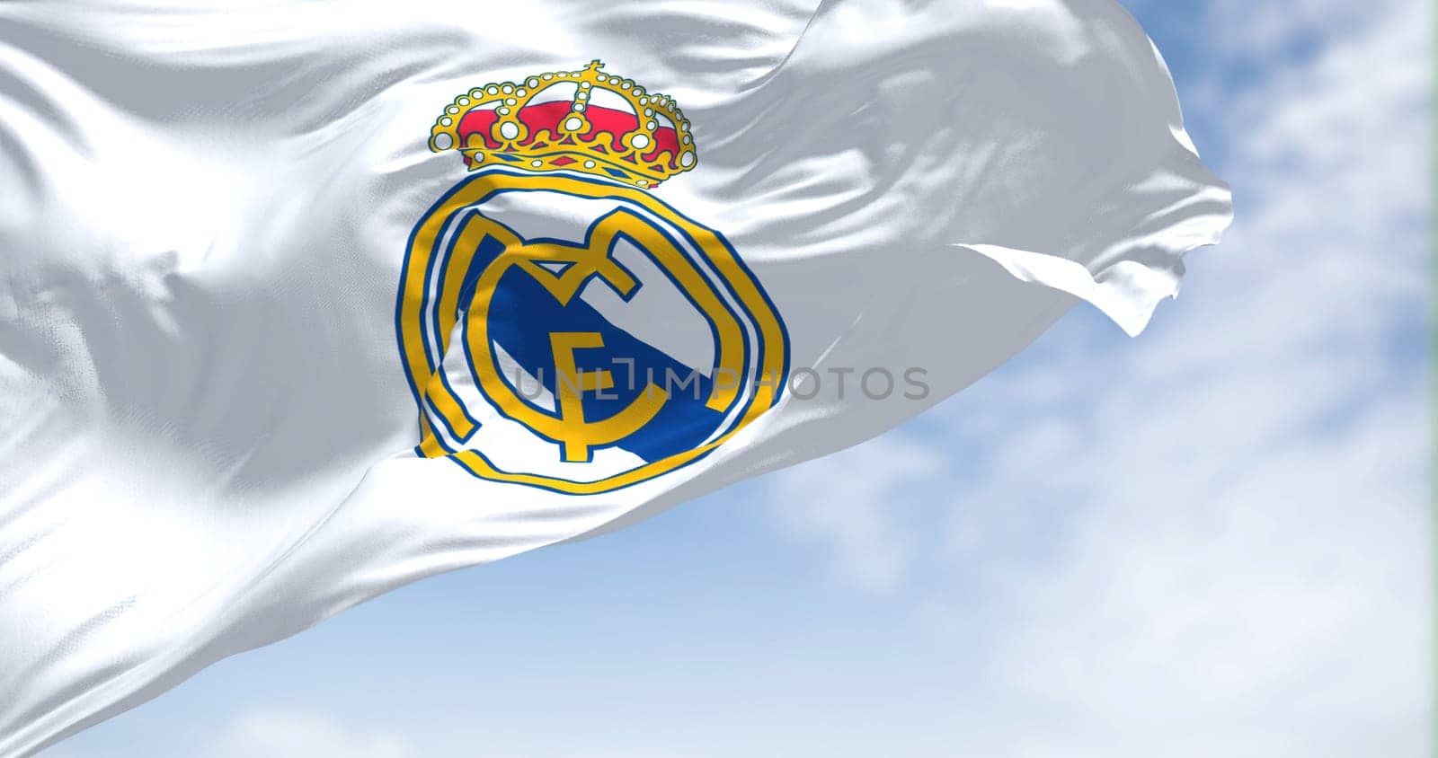 Madrid, Spain, June 2022: The Flag of Real Madrid waving in the wind on a clear day. Real Madrid is a Spanish professional football club based in Madrid