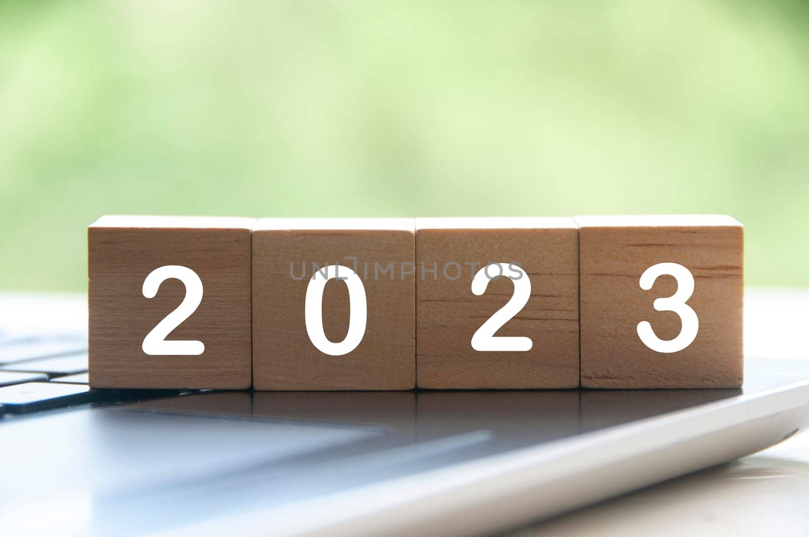 New year 2023 on wooden blocks on a laptop - New year concept